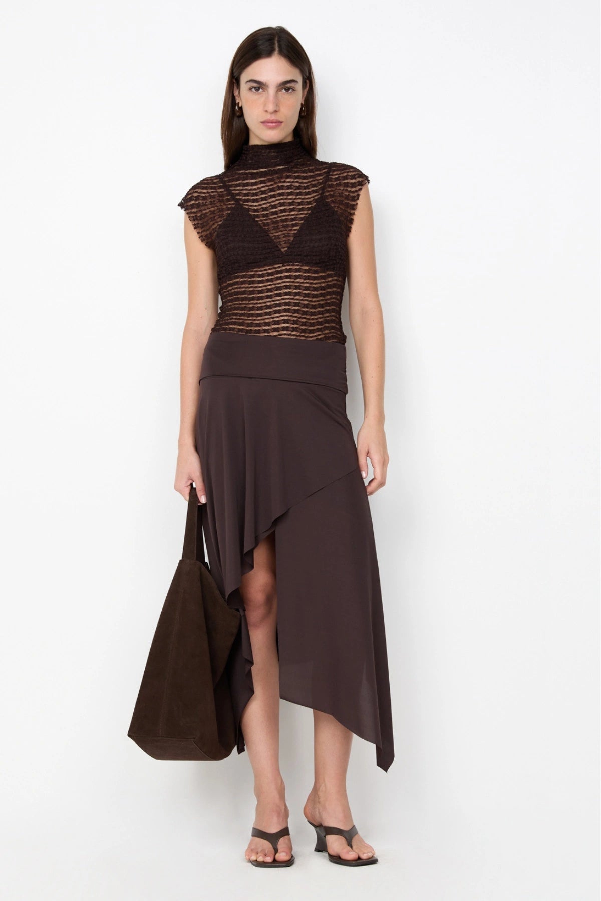 Asym Midi Skirt in Dark Chocolate by Bec + Bridge, designed with a draped silhouette and asymmetric hem for an effortlessly chic look.