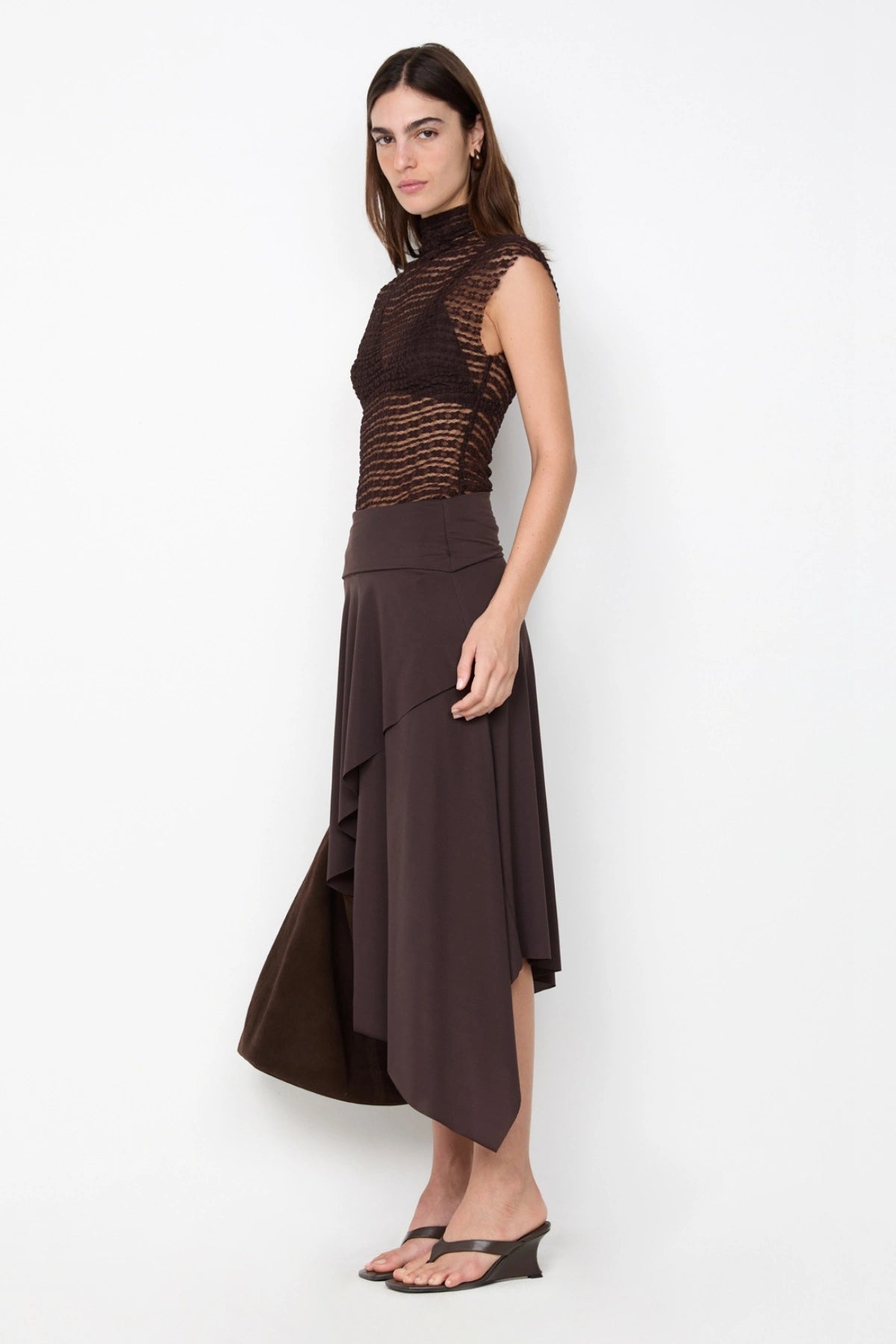 Asym Midi Skirt in Dark Chocolate by Bec + Bridge, designed with a draped silhouette and asymmetric hem for an effortlessly chic look.