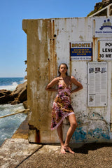 Asym Siren Orchid by Summi Summi – asymmetrical fitted dress with vibrant print and lace detailing for elevated evening styling.