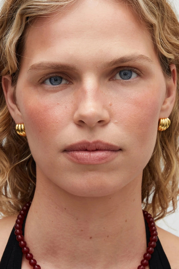 Aurelia Earrings Gold by Heaven Mayhem – ribbed gold stud earrings in 18K PVD plated stainless steel.
