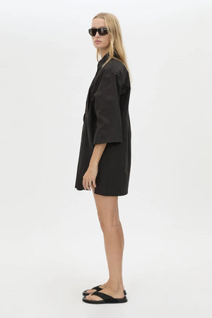 Avant Shirt Dress in Black by Camilla and Marc, a collared cotton shirt dress with pleat detailing, flared sleeves, and side splits.