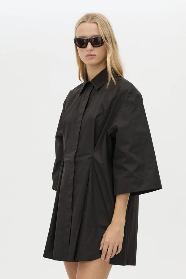 Avant Shirt Dress in Black by Camilla and Marc, a collared cotton shirt dress with pleat detailing, flared sleeves, and side splits.