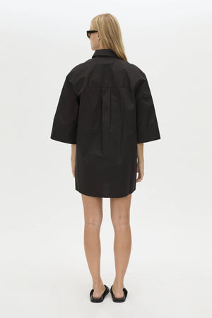 Avant Shirt Dress in Black by Camilla and Marc, a collared cotton shirt dress with pleat detailing, flared sleeves, and side splits.