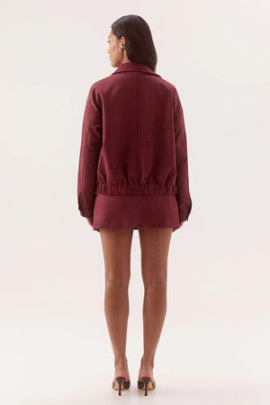 Avery Bomber Cranberry by Sovere, faux suede bomber jacket with relaxed fit for elevated winter layering.