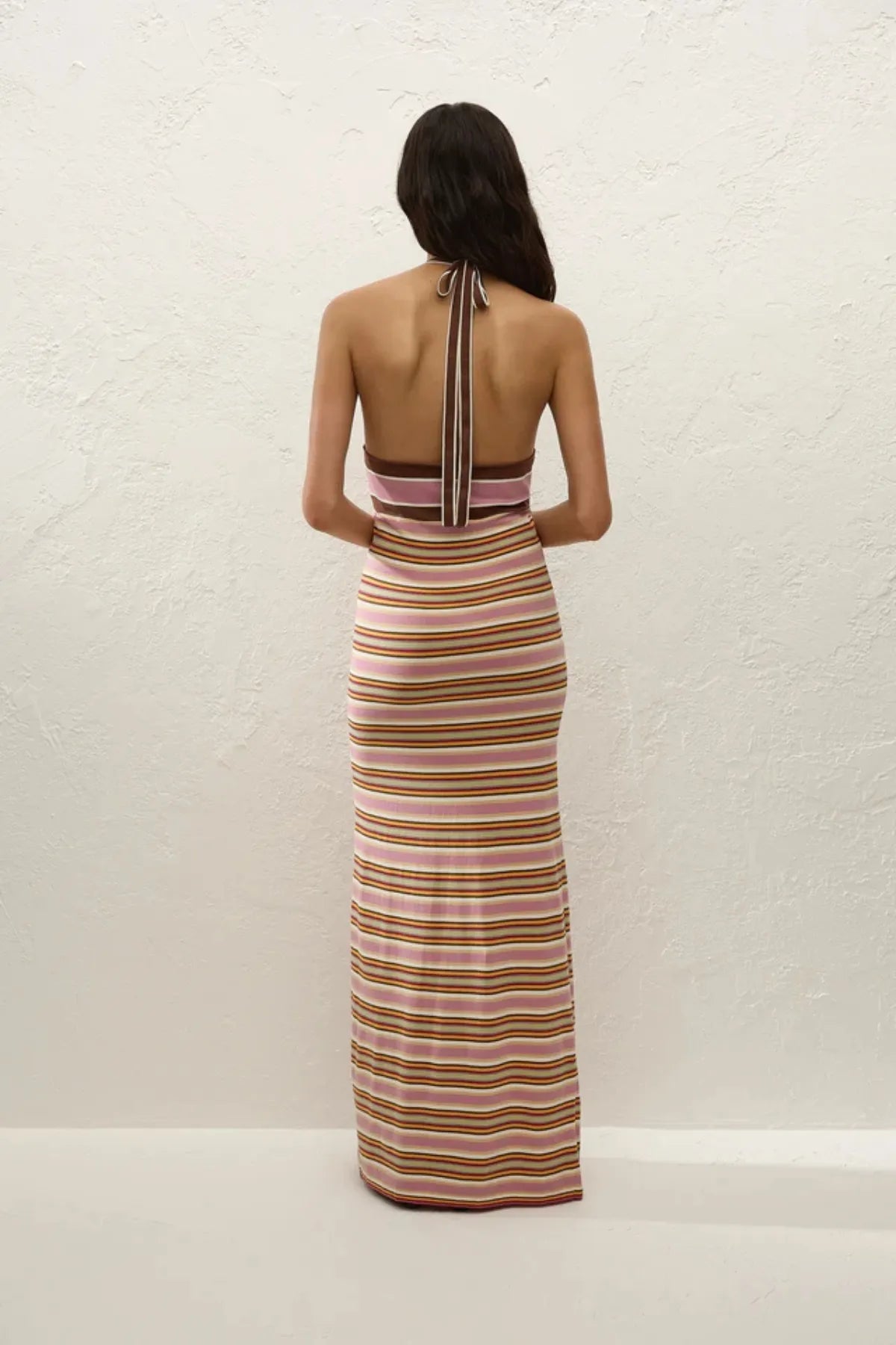 Axel Maxi Dress in Luis Stripe Dusty Mauve by Faithfull the Brand, a halter knit dress in mauve and olive tones. Perfect for warm-weather getaways.
