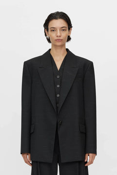 Aya Wool Blazer by Camilla and Marc in black, oversized draped silhouette with cream fleck texture and tailored detailing.
