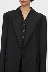 Aya Wool Blazer by Camilla and Marc in black, oversized draped silhouette with cream fleck texture and tailored detailing.
