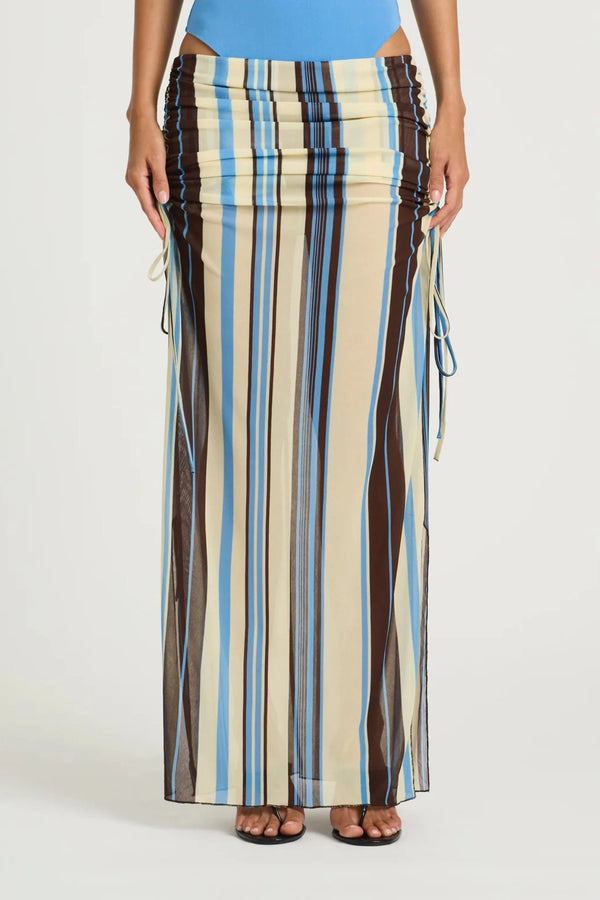 Ayla Maxi Skirt by Benni, ocean stripe sheer mesh maxi with adjustable drawstring sides, low-rise fit and asymmetric ruching.