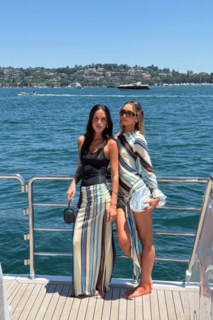 Ayla Maxi Skirt by Benni, ocean stripe sheer mesh maxi with adjustable drawstring sides, low-rise fit and asymmetric ruching.