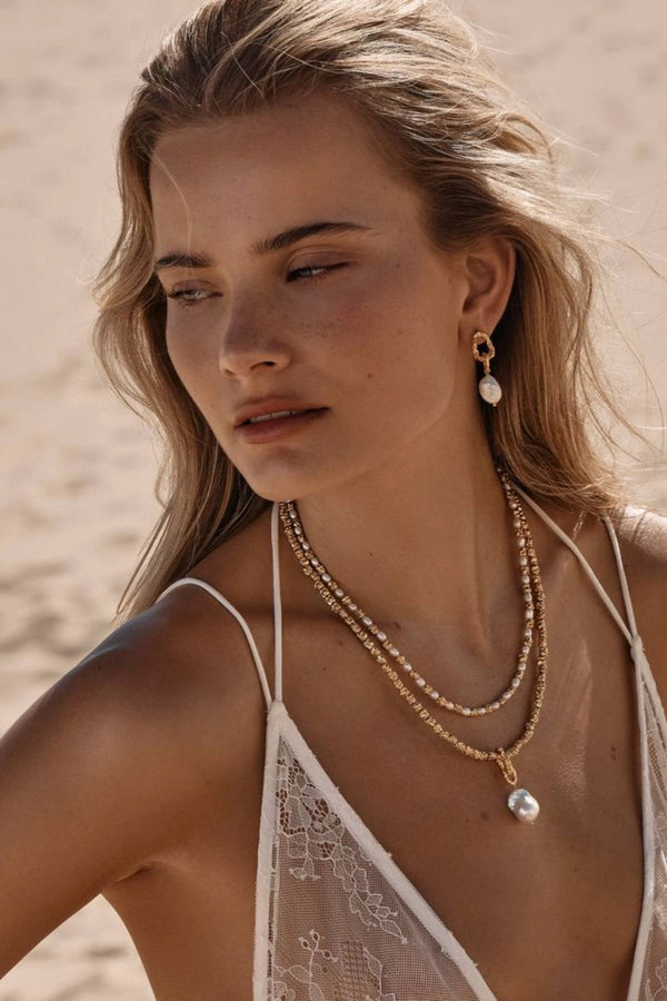 Azar Earrings by Amber Sceats - gold drop earrings with freshwater pearls and chain links, designed for elevated styling.