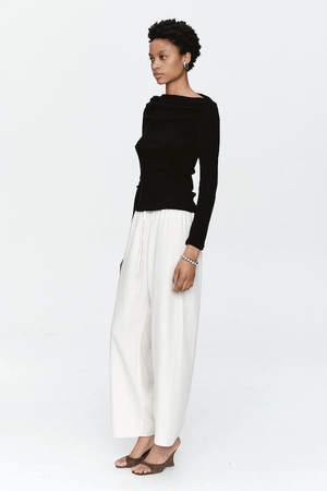 Bryn Top Black by Marle, close-fitting 100% merino wool with soft ribbed texture and gathered boat neckline, perfect for trendy viral layering and elegant everyday wear.