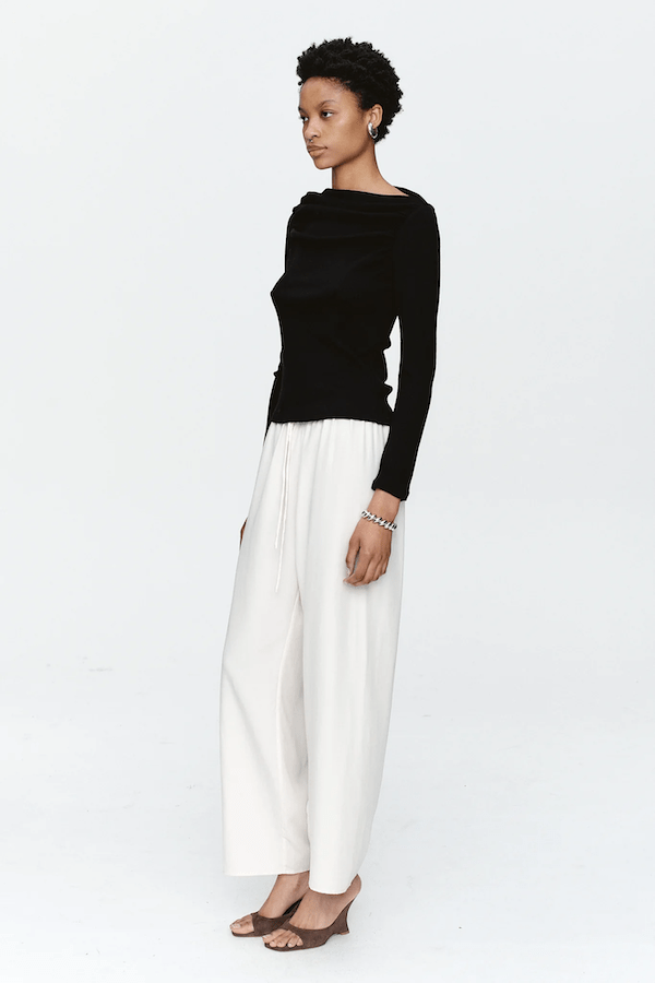 Bryn Top Black by Marle, close-fitting 100% merino wool with soft ribbed texture and gathered boat neckline, perfect for trendy viral layering and elegant everyday wear.