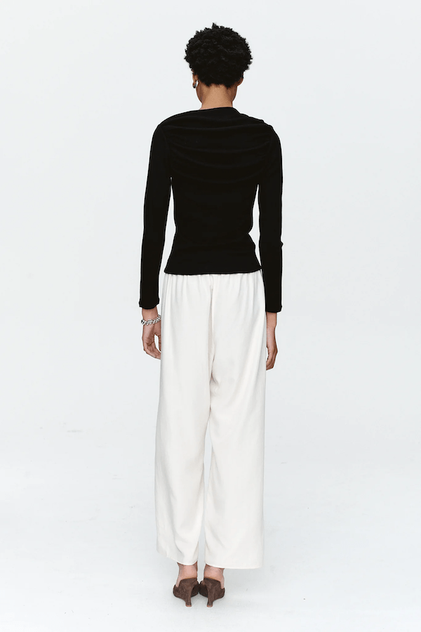 Bryn Top Black by Marle, close-fitting 100% merino wool with soft ribbed texture and gathered boat neckline, perfect for trendy viral layering and elegant everyday wear.