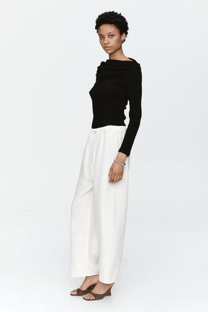 Bryn Top Black by Marle, close-fitting 100% merino wool with soft ribbed texture and gathered boat neckline, perfect for trendy viral layering and elegant everyday wear.