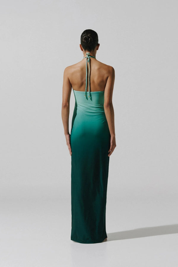 Bari Maxi Dress by Baobab, a shimmering halter gown with resin stones, side slit, and open back. Perfect for elegant summer nights.