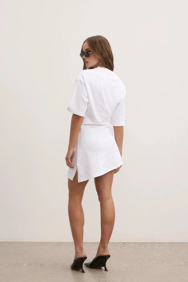 Bayse Joanna Dress in White, a relaxed cotton t-shirt dress with dropped shoulders and asymmetric hemline for everyday ease.
