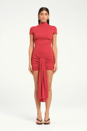 Astrid Mini Dress Scarlet by Benni, figure-skimming silhouette with side ruching, center-front sash, and high-stretch jersey for a flattering fit.