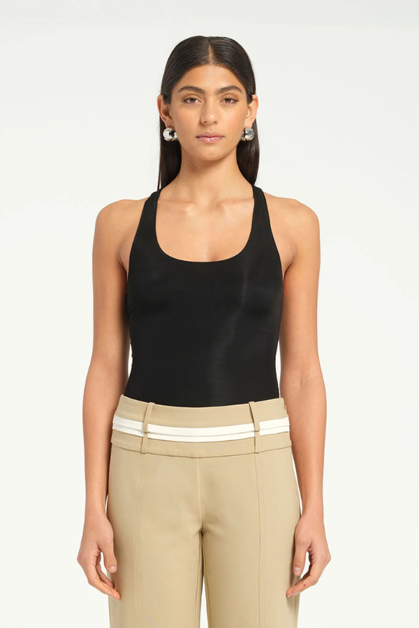 Jade Bodysuit Black by Benni, sleek and minimal with high-stretch jersey, racerback design, and snap closures for a seamless fit.