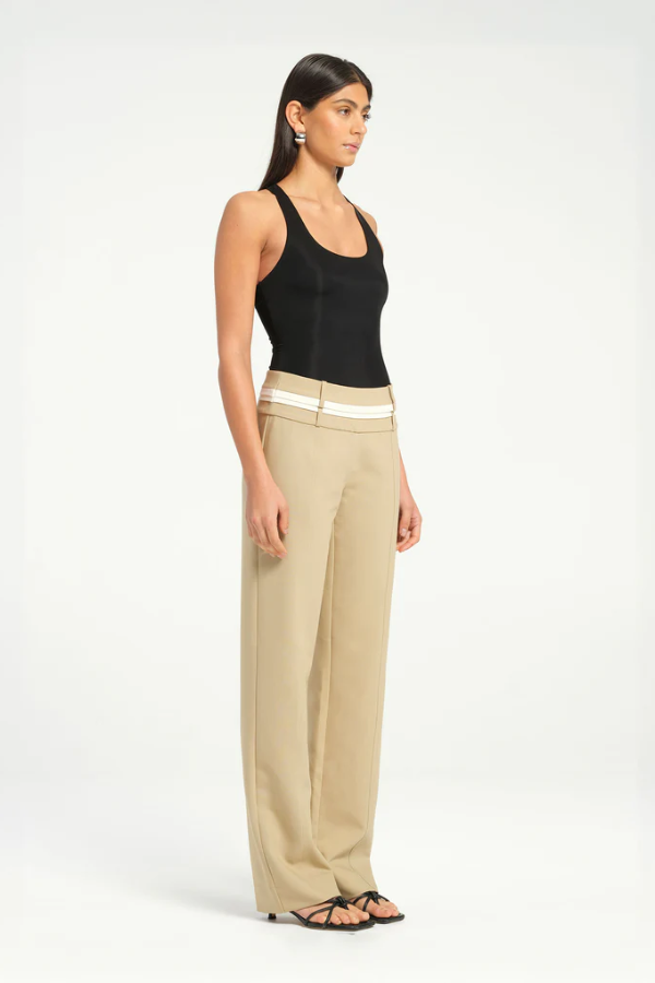 Jade Bodysuit Black by Benni, sleek and minimal with high-stretch jersey, racerback design, and snap closures for a seamless fit.