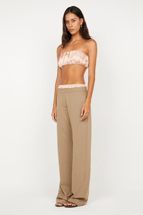 Jai Bandeau in Peach by Bec + Bridge, a washed silk strapless top with adjustable straps and picot edging for a chic day-to-night look.