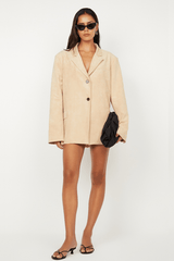 Lyon Jacket by Bec + Bridge, an oversized faux suede blazer in nougat with a single-breasted design and welt pockets for versatile styling.
