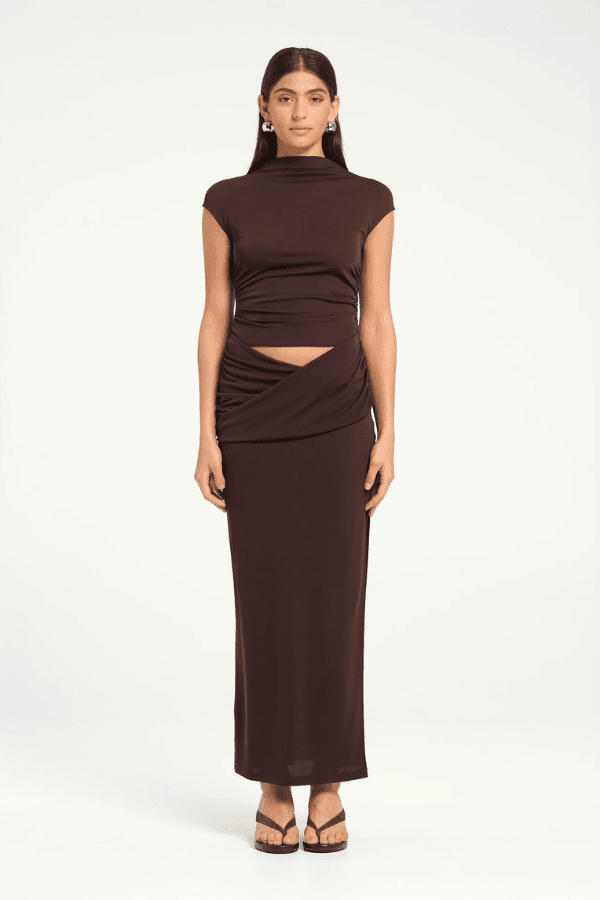 Royce Maxi Dress Aqua by Bec + Bridge, a sleek silhouette with twisted waist detail, subtle cut-outs, cowl waist, and side split for modern evening elegance.
