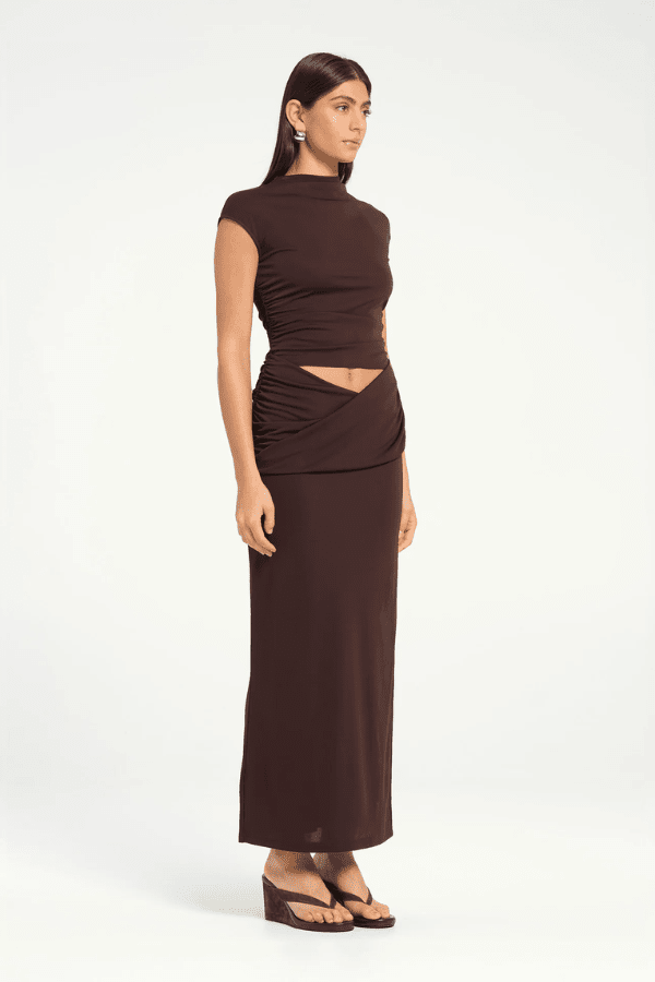 Royce Maxi Dress Aqua by Bec + Bridge, a sleek silhouette with twisted waist detail, subtle cut-outs, cowl waist, and side split for modern evening elegance.