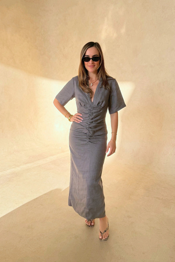 Belle Midi Dress in Steel by Sneaky Link, crafted from breathable linen with ruched shaping and arm coverage. Perfect for warm-weather elegance.
