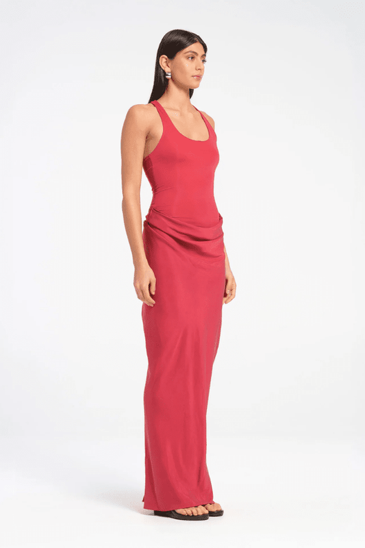 Jade Dress Scarlet by Benni, a sculptural silhouette with a slim-fit bodysuit, fluid skirt, cowl waist, and gathered back for bold, feminine energy.