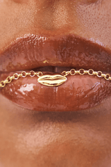 Bisous Necklace in Gold by Avant Studio, gold chain with lips charm detail. Perfect for everyday wear or a playful gift.