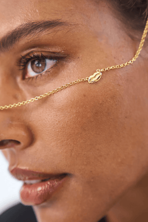 Bisous Necklace in Gold by Avant Studio, gold chain with lips charm detail. Perfect for everyday wear or a playful gift.