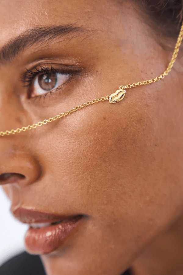 Bisous Necklace in Gold by Avant Studio, gold chain with lips charm detail. Perfect for everyday wear or a playful gift.