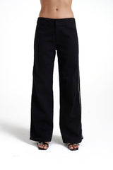Zip Jeans Black Denim by Summi Summi, trendy mid-rise jeans with a slightly wide-leg design and full-length zippers for a modern edge. Perfect for a relaxed yet stylish look in 100% black cotton denim.