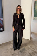 Black Rita knit cardigan with long sleeves and a relaxed fit, displayed on a plain white background.