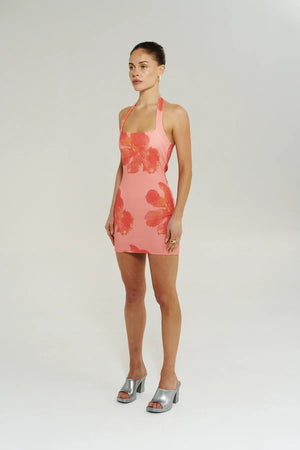 Bloom Mini Dress in Peach Petals by Summi Summi, a fitted halter mini dress with a soft floral print and stretchy cotton blend knit.