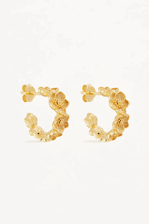 Bloom With Grace Hoops by By Charlotte, 18k gold vermeil sculptural tapered hoops with a textured floral-inspired finish.
