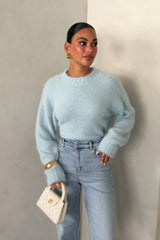 Blue Kaia crew neck sweater with long sleeves and a relaxed fit.