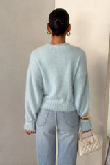 Blue Kaia crew neck sweater with long sleeves and a relaxed fit.