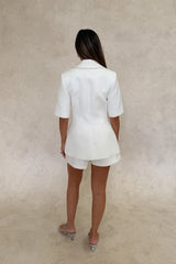 Bobbie Blazer Top White by Sneaky Link – a tailored blazer top with sharp lapels and cinched fit. Perfect for elevated styling.