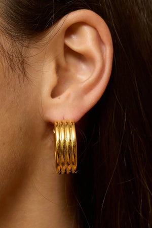 Bondi Waves Hoops Gold by Emma Pills, sculptural medium hoop earrings with ridged gold finish for elevated everyday styling.