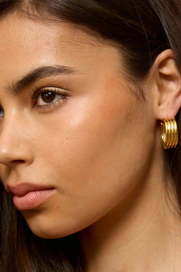 Bondi Waves Hoops Gold by Emma Pills, sculptural medium hoop earrings with ridged gold finish for elevated everyday styling.
