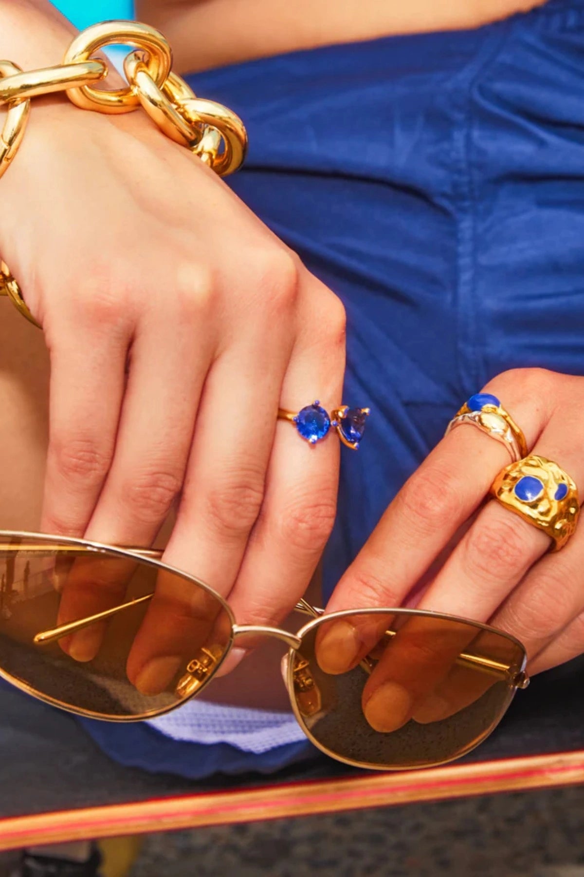 Bondi Waves Ring Gold Blue by Emma Pills, a deconstructed gold plated ring with blue enamel accents inspired by ocean waves.