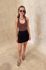 Bonnie Mini Skirt Black by Sneaky Link – a tailored mini skirt with structured fit and stretch. Perfect for day-to-night styling.