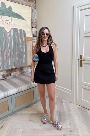 Bonnie Mini Skirt Black by Sneaky Link – a tailored mini skirt with structured fit and stretch. Perfect for day-to-night styling.