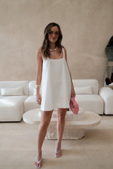 Boston Mini Dress White by Sneaky Link – a lightweight cotton mini with easy fit. Perfect for effortless summer styling.