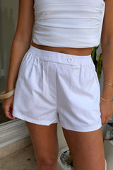 Boston Poplin Short White by Sneaky Link – cotton shorts with elastic waist and button detail. Perfect for easy summer styling.