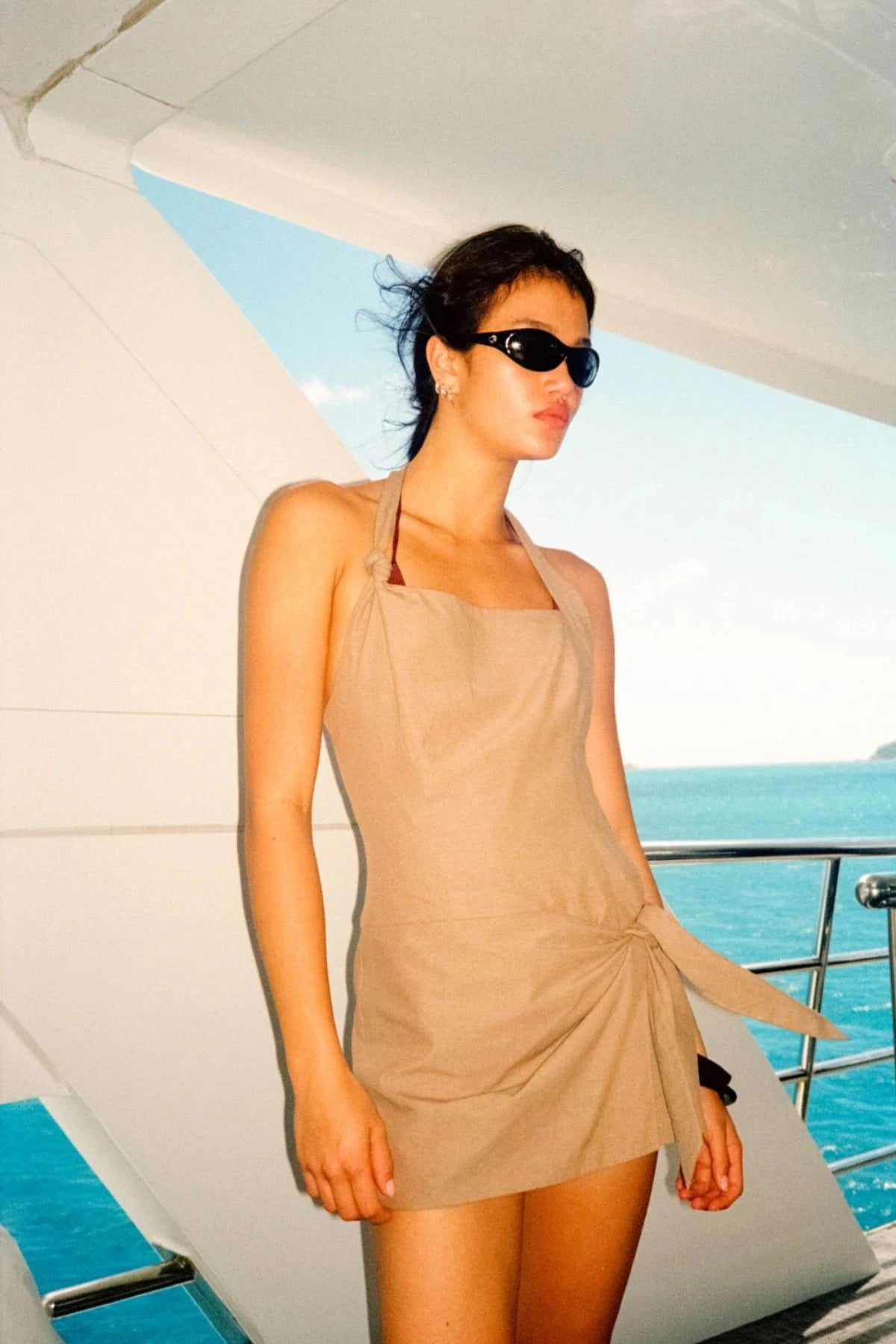 Bowen Playsuit by Bec + Bridge, olive suiting romper with knot strap and wrap skort. Perfect for elevated day-to-night dressing.