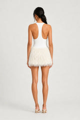 Bronte Mini Dress Ivory by Benni – jersey bodysuit mini dress with racerback and textured shaggy fringe skirt.
