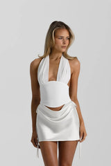 Bronte Top in White by Natalie Rolt, a ruched halter with lace-up back and curved bust. Perfect for elevated pairings or events.