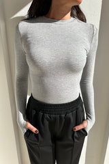 Brooklyn Top by Mossman – a fitted knit top with high neckline and thumb sleeves. Perfect for layering or everyday wear.